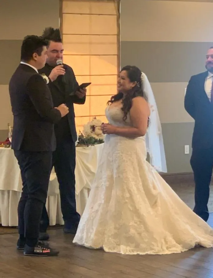 Bride and groom sharing a moment during their wedding ceremony.